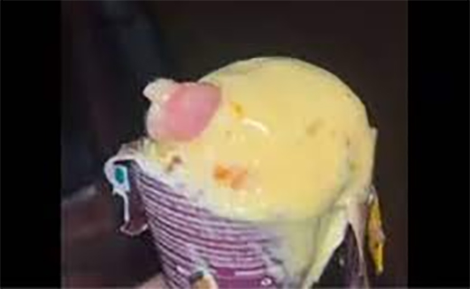Human finger in icecream 